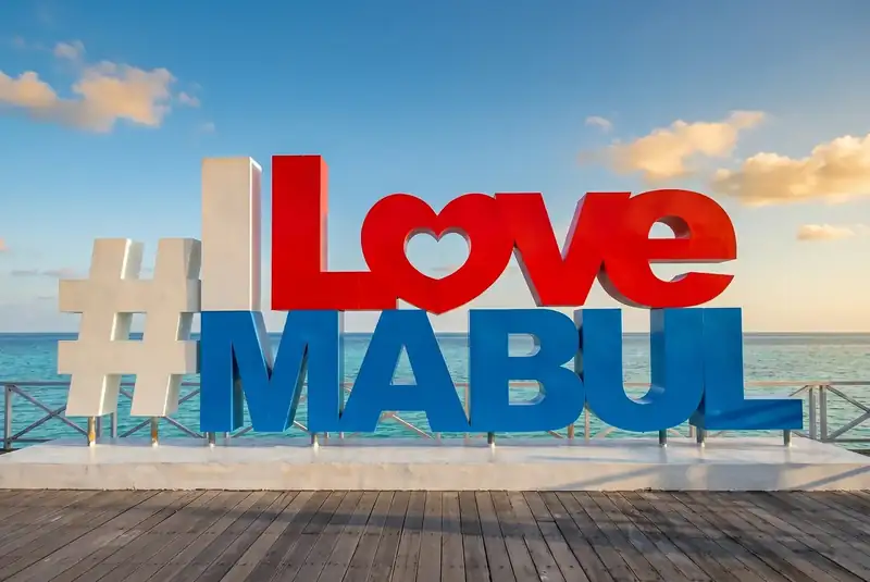 Iconic photo spot at the I Love Mabul sign on Mabul Island Nusakuya Resort